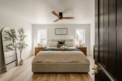 a bedroom with a bed and a ceiling fan at Modern Amish Country Retreat w/ Hot Tub. in Leola