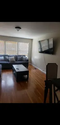 a living room with a couch and a coffee table at Beautiful 3 Bed Vacation home in Newark