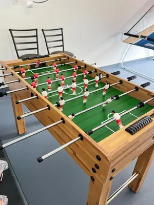 a foosball game on a table at Explore Poconos with Fire pit, Games, Grill in Tobyhanna