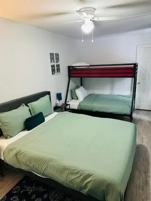 a bedroom with two beds and a ceiling at Explore Poconos with Fire pit, Games, Grill in Tobyhanna