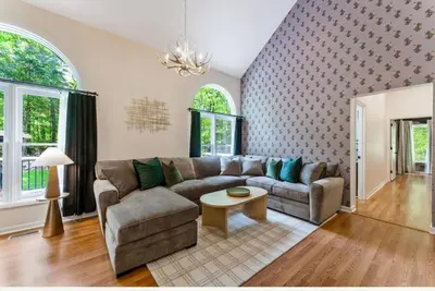 a living room with a couch and a table at Dine Outdoors, Dream Indoors 5BR in East Stroudsburg
