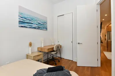 a bedroom with a bed and a desk and a table at Boho Rustic Escape with Masssive Terrace in Midtown in New York