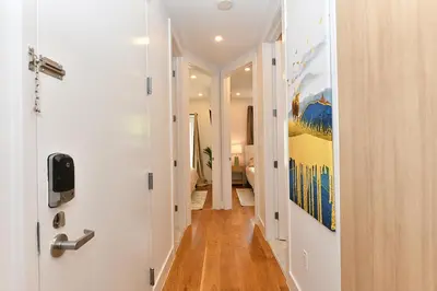 a hallway with a door leading to a room at Boho Rustic Escape with Masssive Terrace in Midtown in New York