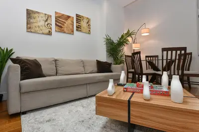 a living room with a couch and a coffee table at Boho Rustic Escape with Masssive Terrace in Midtown in New York