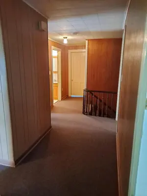 an empty hallway with a staircase in a building at The Canton House