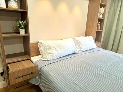 a bedroom with a bed and a book shelf at The Canopy 4BR Forest Escape Spa, Sip, and Unwind in Vernon Township