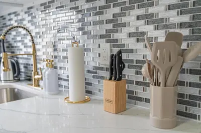 a kitchen counter with a knife block and utensils at Style & Comfort 3 Rooms -15 min from NYC in West New York