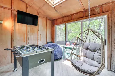 a room with a hammock and a game table at Steps to Jack Frost Ski Resort Townhome with Decks in Lake Harmony