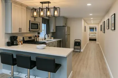 a kitchen with a large island in the middle at Group-Friendly Luxury 3BR 2 Baths Sleeps 8 in Irvington