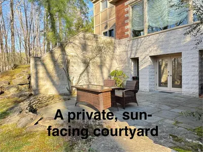 a facing courtyard with a bench and a house at Zen House in Princeton