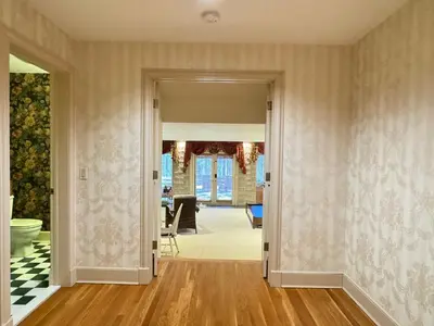 a hallway with a door leading to a dining room at Zen House in Princeton