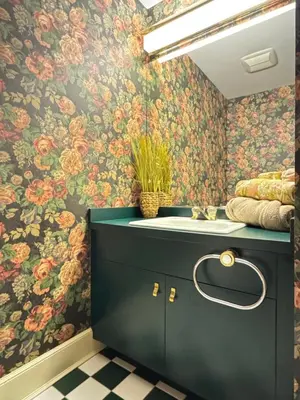 a bathroom with a sink and floral wallpaper at Zen House in Princeton
