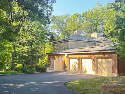a house with a garage and a driveway at Zen House in Princeton