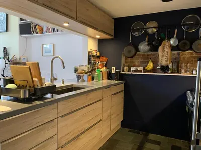 a kitchen with a sink and a counter top at Airy brownstone penthouse duplex near Central Park in New York