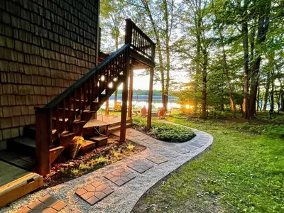 a stairway with a bench next to a house at Swept Away in Arrowhead Lake in Arrowhead Lake