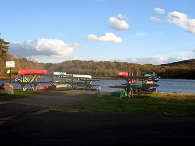 a group of boats parked on the shore of a lake at Swept Away in Arrowhead Lake in Arrowhead Lake