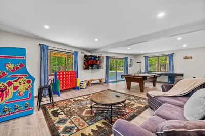 a living room with a pool table and a game room at Hot Tub and Community Beach Albrightsville Home! in Albrightsville