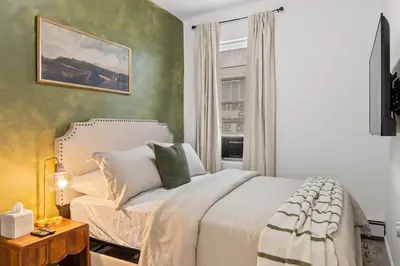 a bedroom with a white bed and a window at Style & Comfort 3 Rooms 15 min from NYC in West New York