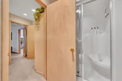 a bathroom with a shower and a sink at Lakefront at the Hideout in Lake Ariel