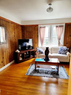 a living room with a couch and a tv at Entire rear squad-bay in Carlisle