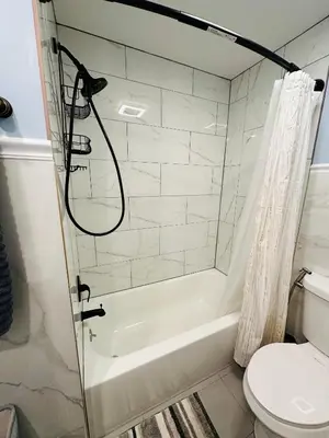 a bathroom with a shower and a toilet at The Peaceful Perch Retreat Near NYC Elle's Home in Trenton