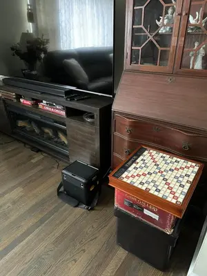 a living room with a chess board and a cabinet at The Peaceful Perch Retreat Near NYC Elle's Home in Trenton