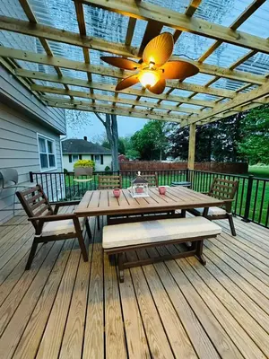 a wooden table and benches on a wooden deck at The Soft Landing Elle's Home Near NYC in Trenton