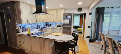 a kitchen with a sink and a refrigerator at Getaway at the Hideout in Lake Ariel
