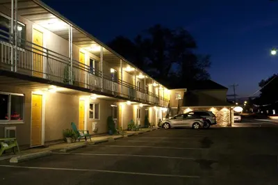 a car parked in front of a building at night at Macaluso's at the Lantern Lodge in Jim Thorpe