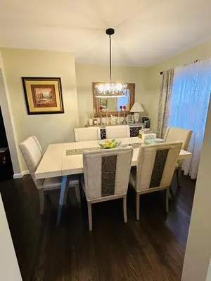 a dining room with a table and chairs at The Trenton Two 2BR Peaceful Oasis with Patio - Shared Home in Trenton