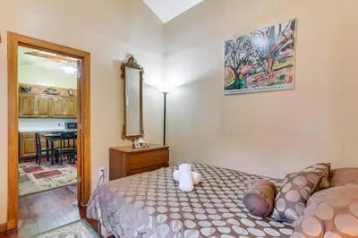 a small bedroom with a bed and a mirror at 5 Mi to Marina and Raceways Mongaup Valley Retreat! in Mongaup Valley