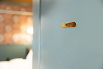 a door with a sign that says day on it at The Gas Lamp Hotel in Philadelphia