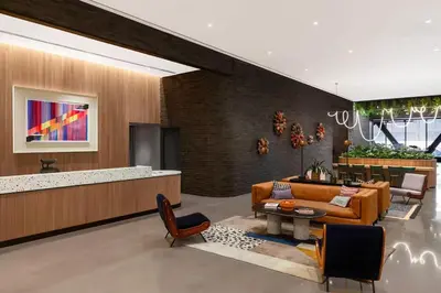 a living room with a couch and a table at Luxury Apartments by Hyatus at Central Philly in Philadelphia