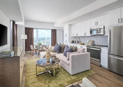 a living room with a couch and a table at Luxury Apartments by Hyatus at Central Philly in Philadelphia