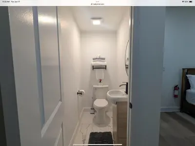 a small bathroom with a toilet and a sink at Sava apt rentals in Newark