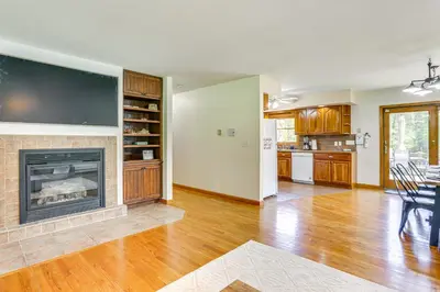 a living room with a fireplace with a tv at Home Theater and Game Room Home in Glen Wild! in Glen Wild