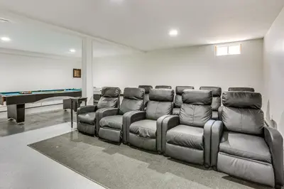 a group of leather chairs in a room with a pool table at Home Theater and Game Room Home in Glen Wild! in Glen Wild