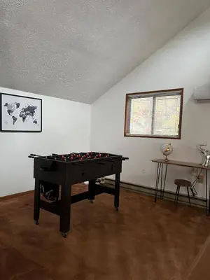 a room with a pool table in the corner of a room at Lovely tranquil spot for family and friends to gather in Tobyhanna