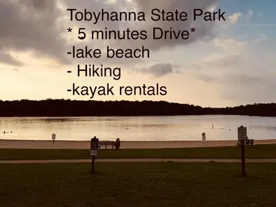 a park with the words tokyoanna state park minutes drive take beach at Lovely tranquil spot for family and friends to gather in Tobyhanna