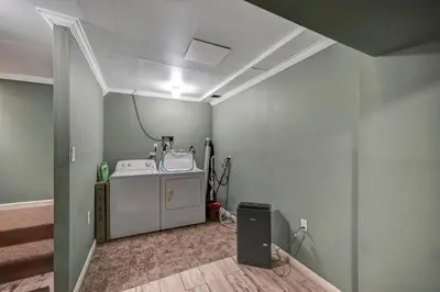 a laundry room with a washer and dryer at Pocono Chalet Towamensing with Hot Tub Lake and Pool in Albrightsville