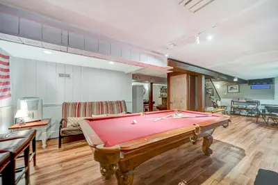 a living room with a pool table in it at Lake harmony estates beach and lake access in Lake Harmony
