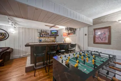 a bar with a pool table in a room at Lake harmony estates beach and lake access in Lake Harmony