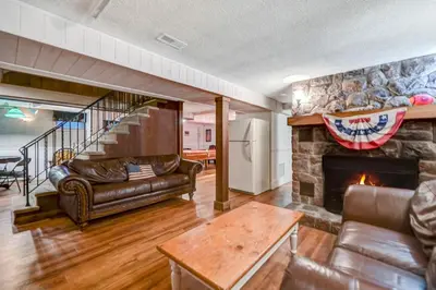 a living room with a couch and a fireplace at Lake harmony estates beach and lake access in Lake Harmony