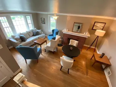 a living room with a couch and chairs and a fireplace at Family Home in mainheim PA close to atractions in Manheim