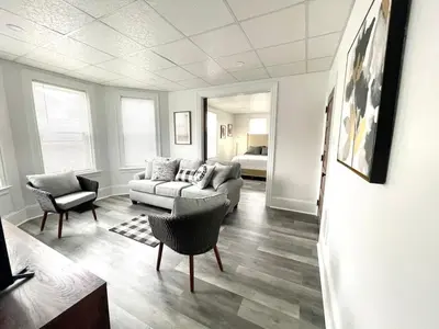 a living room with a couch and two chairs at Cozy Lancaster Apartment Near Attractions in Lancaster