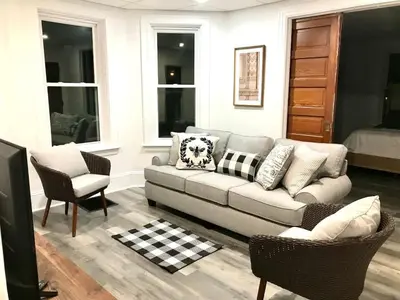 a living room with a couch and two chairs at Cozy Lancaster Apartment Near Attractions in Lancaster