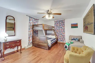a bedroom with a bunk bed and a desk at Game Room! Lake-View Gem 7 Mi to Camelback Slopes in Long Pond