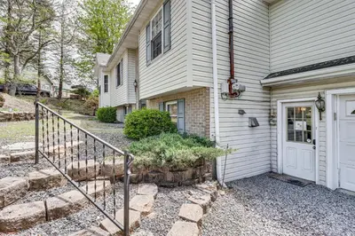a white house with a white door and stairs at Game Room! Lake-View Gem 7 Mi to Camelback Slopes in Long Pond