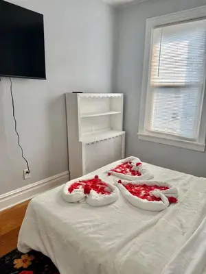 three trays of red food in white bowls on a bed at Heaven on earth in Bayonne
