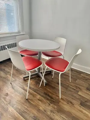 a white table with four chairs and a white table at Heaven on earth in Bayonne